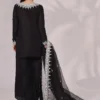 Back view of the Inaya Black & White Raw Silk Set, highlighting the luxurious fabric and elegant dupatta. The intricate embroidery and mirror work are a stunning feature.