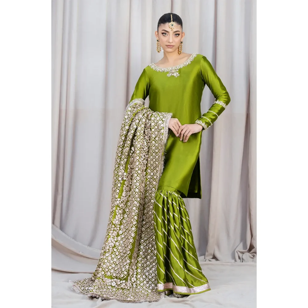 Luxury Rose Silk Gharara with Hand-Embellished Organza Dupatta Rose gold tissue silk gharara with diagonal gota patti lines, perfect for weddings and special occasions."