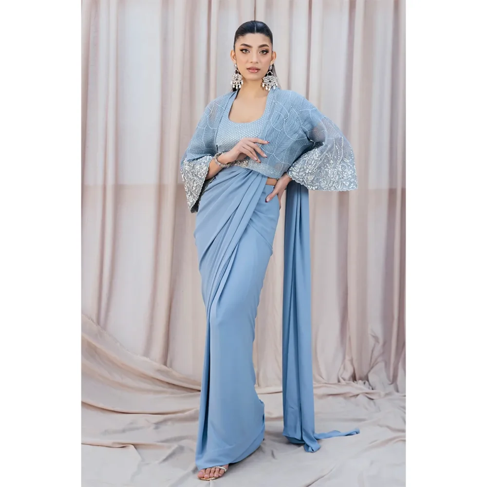 Sky Blue Fusion Saree with Hand-Embellished Cape – Luxury Traditional Wear Full Outfit Image "Sky Blue Fusion Saree with organza cape, modern belt, and hand-embellished details, perfect for weddings and formal events."