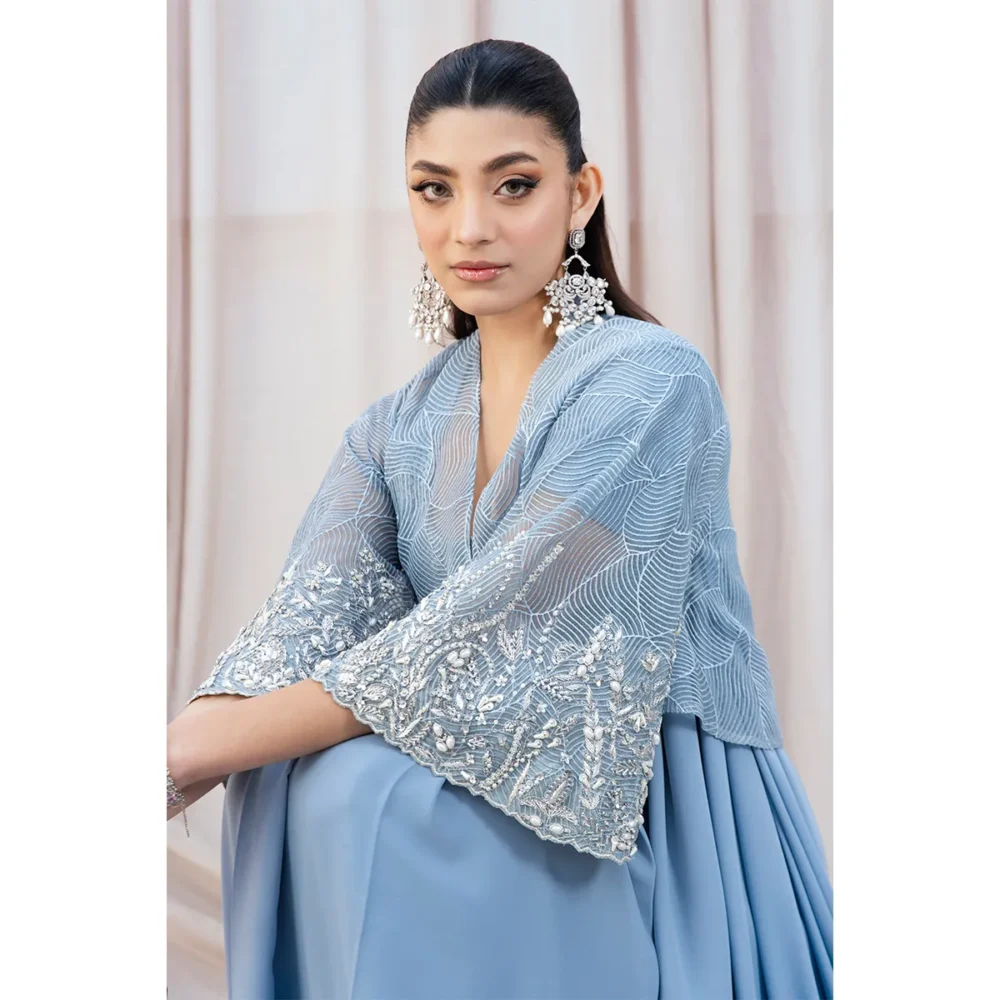 Sky Blue Fusion Saree with Hand-Embellished Cape – Luxury Traditional Wear Fabric Detail "Close-up of double crepe fabric, offering luxurious structure and comfort in the Sky Blue Fusion Saree."