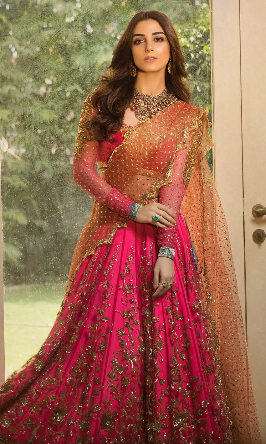 Gulistan-e-Zar Lehenga Choli – Flared fuchsia lehenga with gold & turquoise embroidered border
