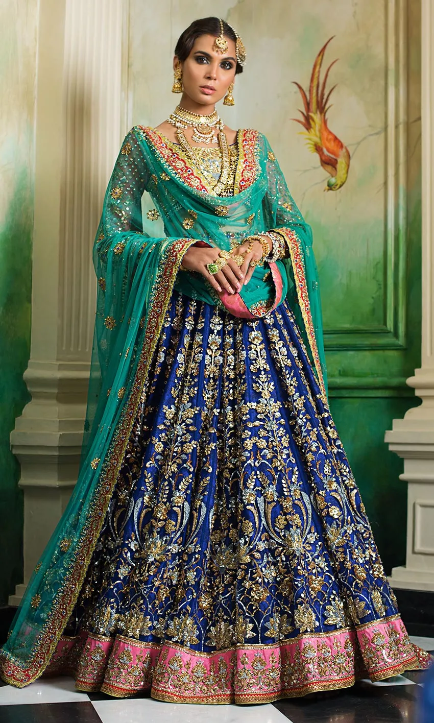 Royal Blue Lehenga Choli – Flared silhouette with intricate golden embellishments.