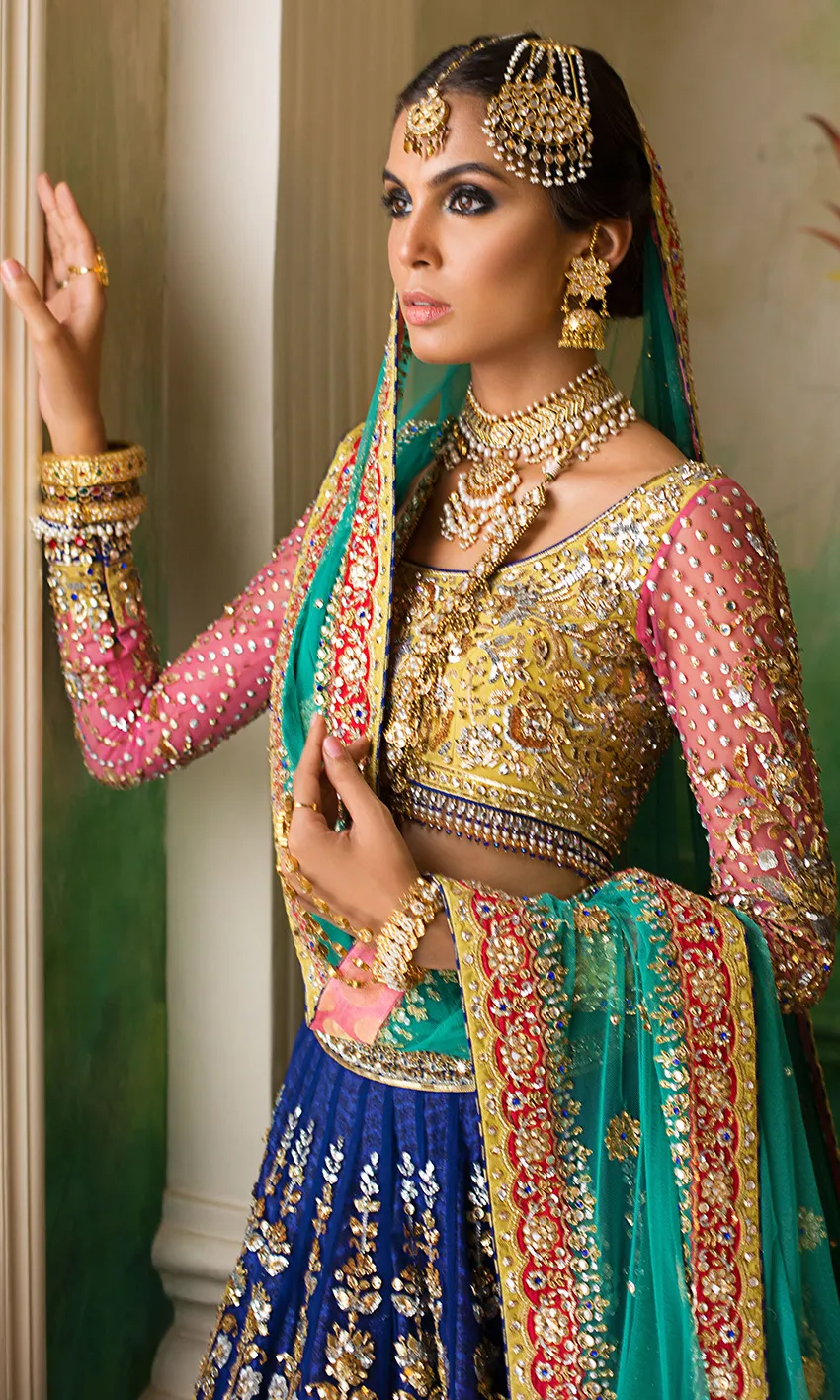 Royal Blue Lehenga Choli – Turquoise net dupatta with embroidered gold border.