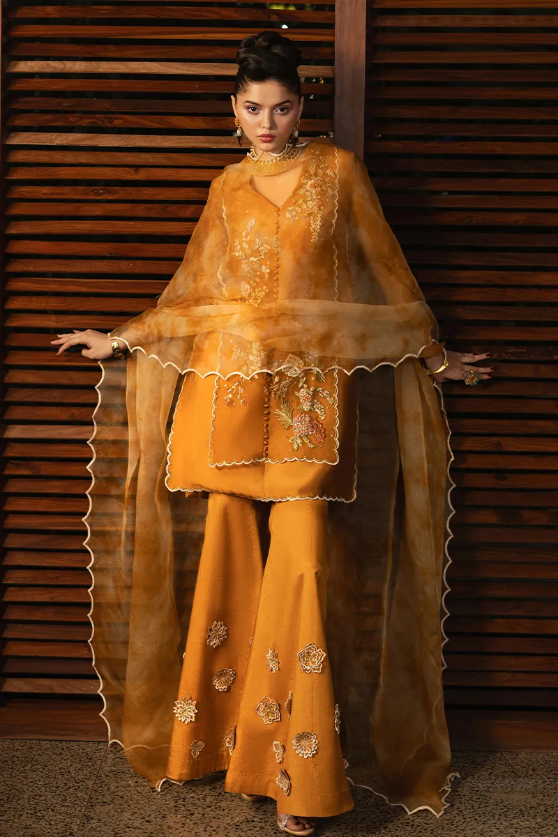 Embroidered organza shirt with V-neck design and waist-high slits, highlighting the craftsmanship and contemporary style.