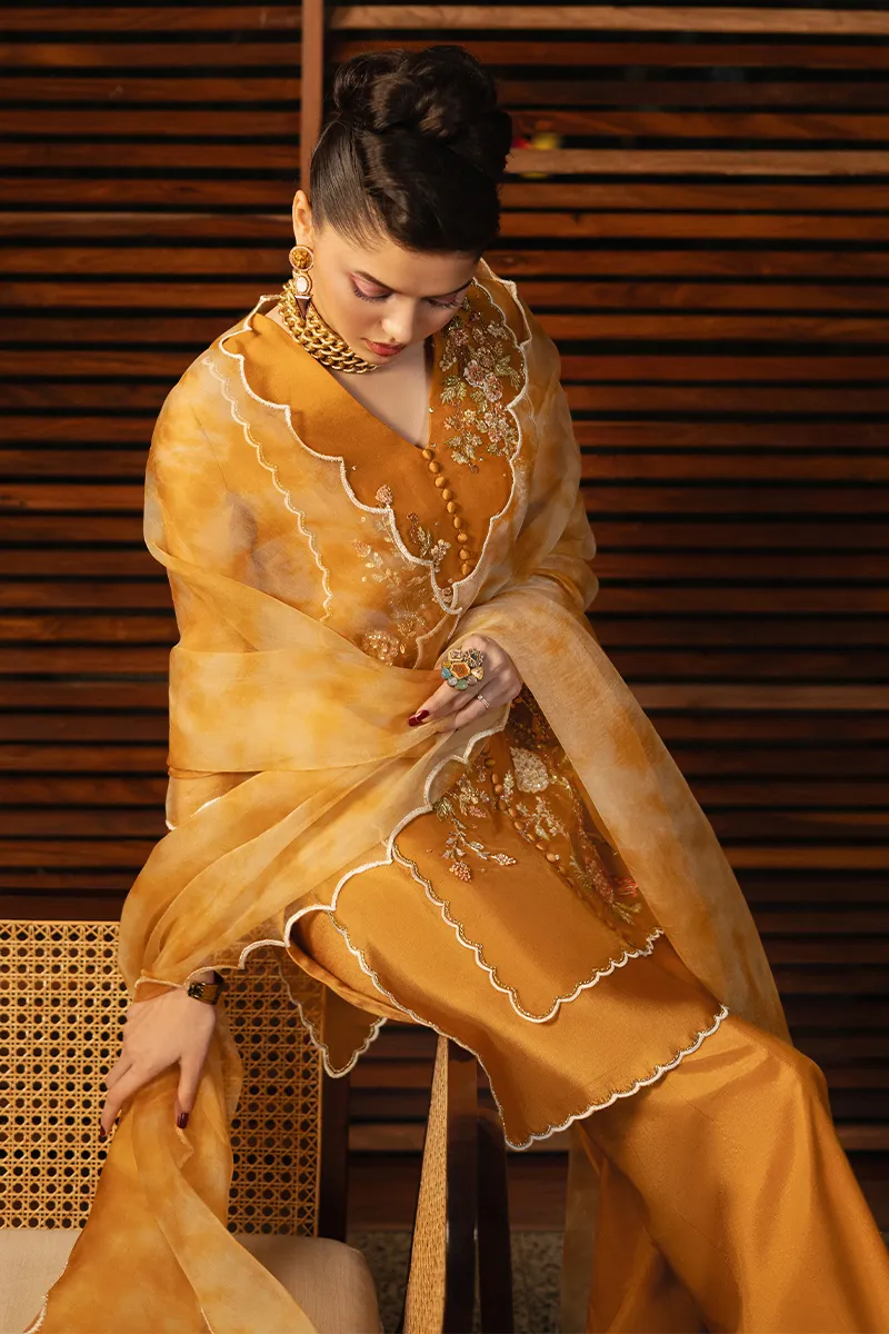 Elegant embroidered organza shirt with boot-cut trouser, featuring intricate hand-embellished florals on luxurious Thai silk fabric.