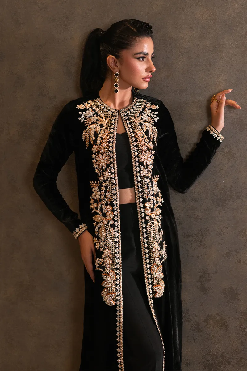 Black velvet jacket with intricate embroidery and vibrant embellishments