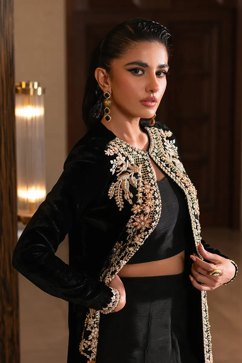 Black velvet jacket with intricate embroidery and vibrant embellishments