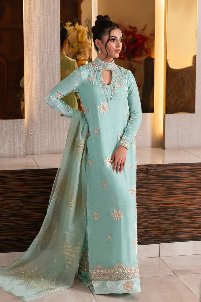 Ice blue velvet shirt with embellished neckline and intricate design