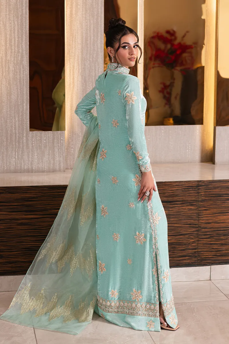 Ice blue velvet shirt with embellished neckline and intricate design