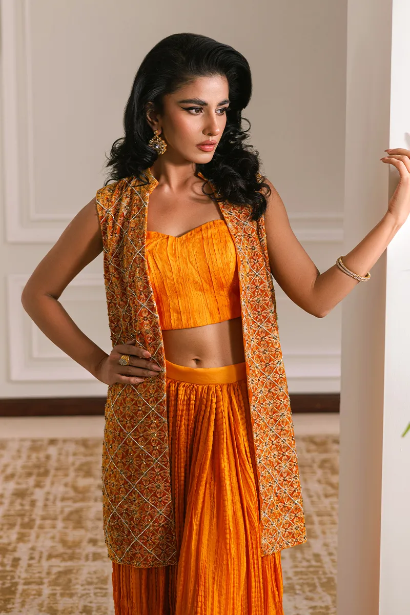 Orange velvet short jacket with intricate embroidery and embellishments
