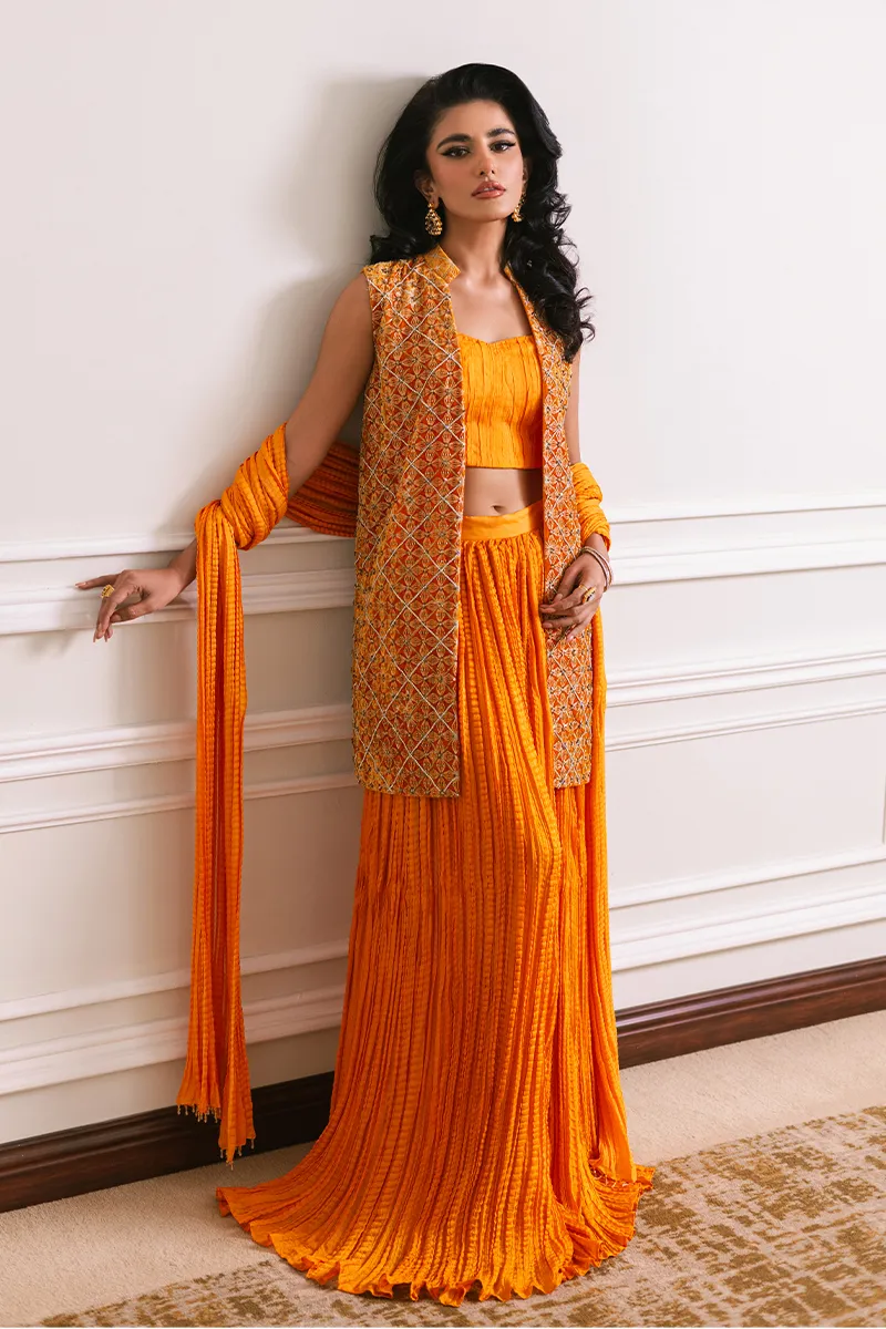 Orange velvet short jacket with intricate embroidery and embellishments