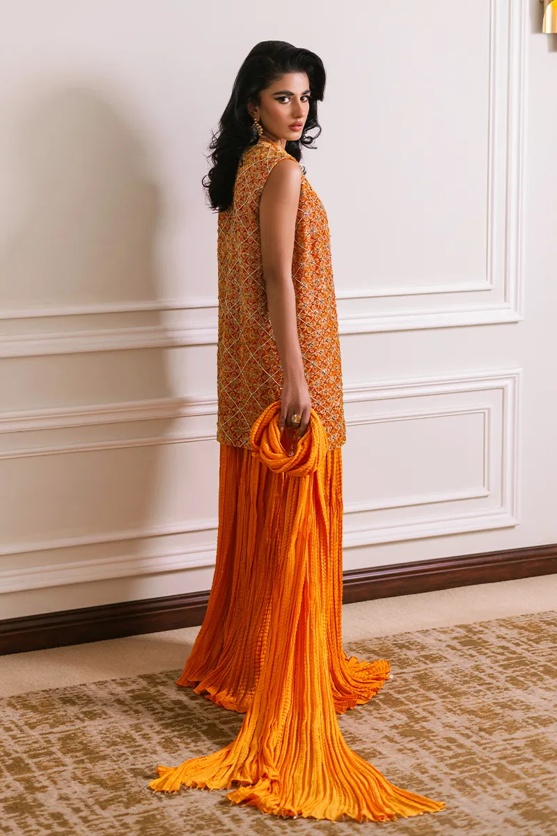 Orange velvet short jacket with intricate embroidery and embellishments