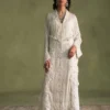 White dress with pearl embellishments and flared sleeves