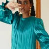 Teal Satin Pleated Gown with Billowing Sleeves and Gold Cuffs