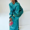 Teal Satin Pleated Gown with Billowing Sleeves and Gold Cuffs