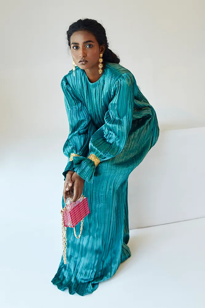 Teal Satin Pleated Gown with Billowing Sleeves and Gold Cuffs