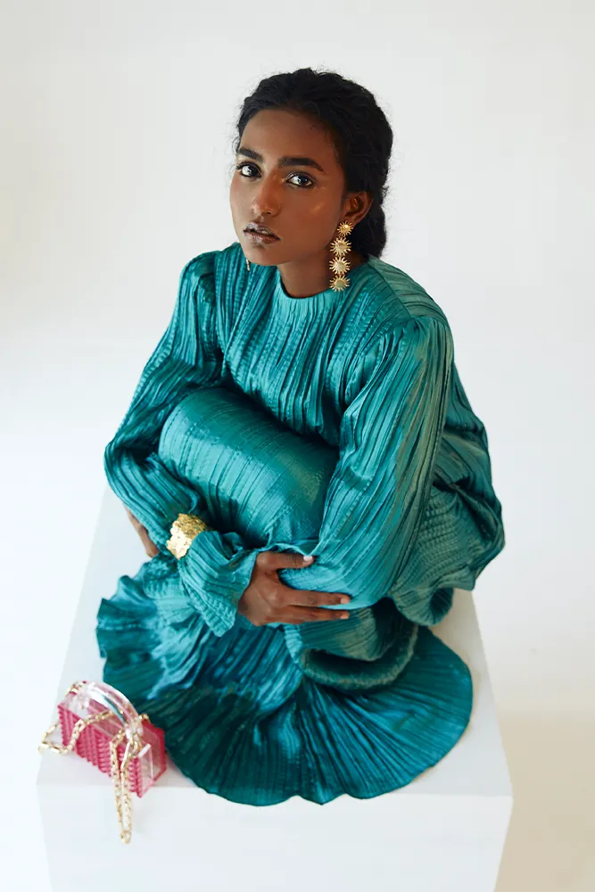 Teal Satin Pleated Gown with Billowing Sleeves and Gold Cuffs