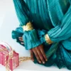Teal Satin Pleated Gown with Billowing Sleeves and Gold Cuffs