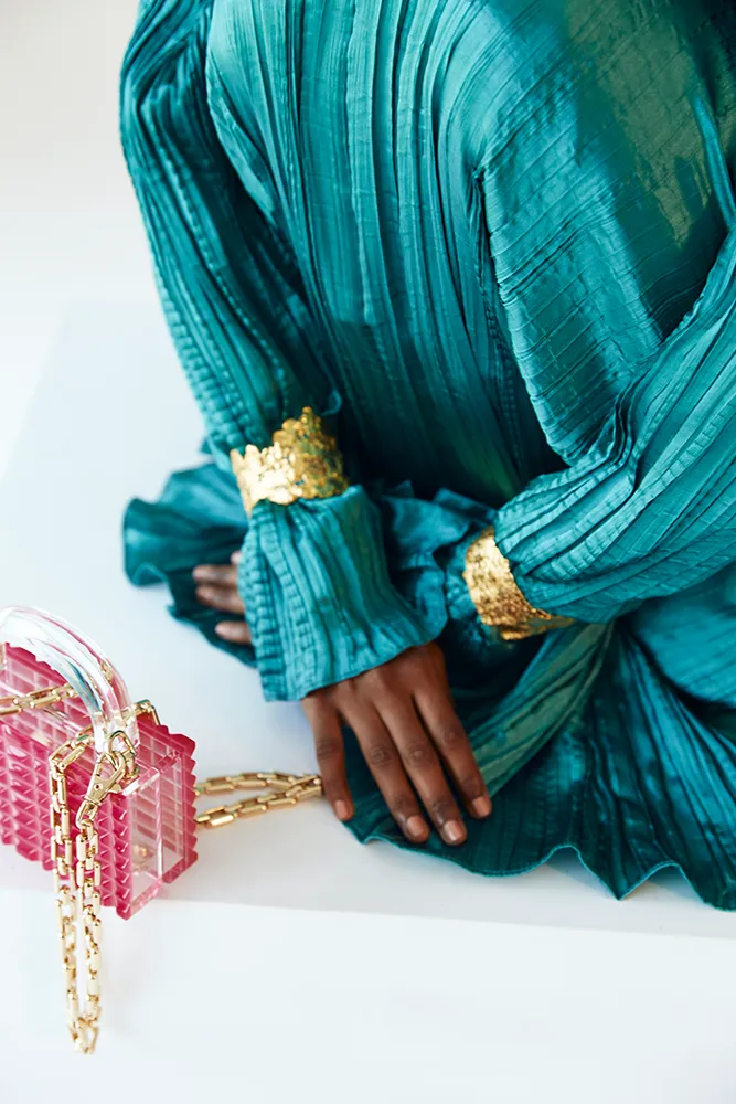 Teal Satin Pleated Gown with Billowing Sleeves and Gold Cuffs