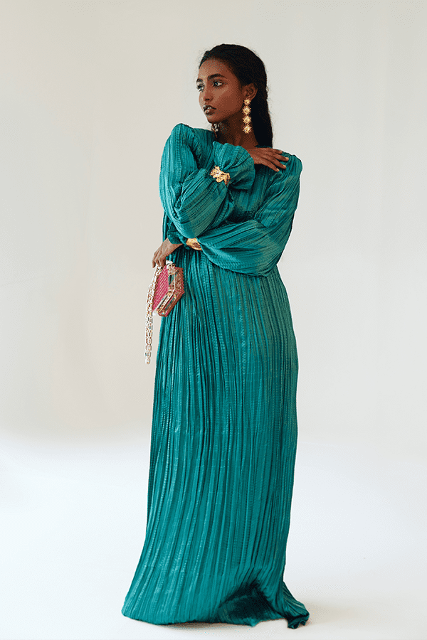 Teal Satin Pleated Gown with Billowing Sleeves and Gold Cuffs