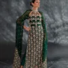 Emerald green dress with intricate crystal embellishments in a close-up shot.