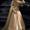 GOLD MASURI NET KALIDAR DRESS shimmering under the lights.