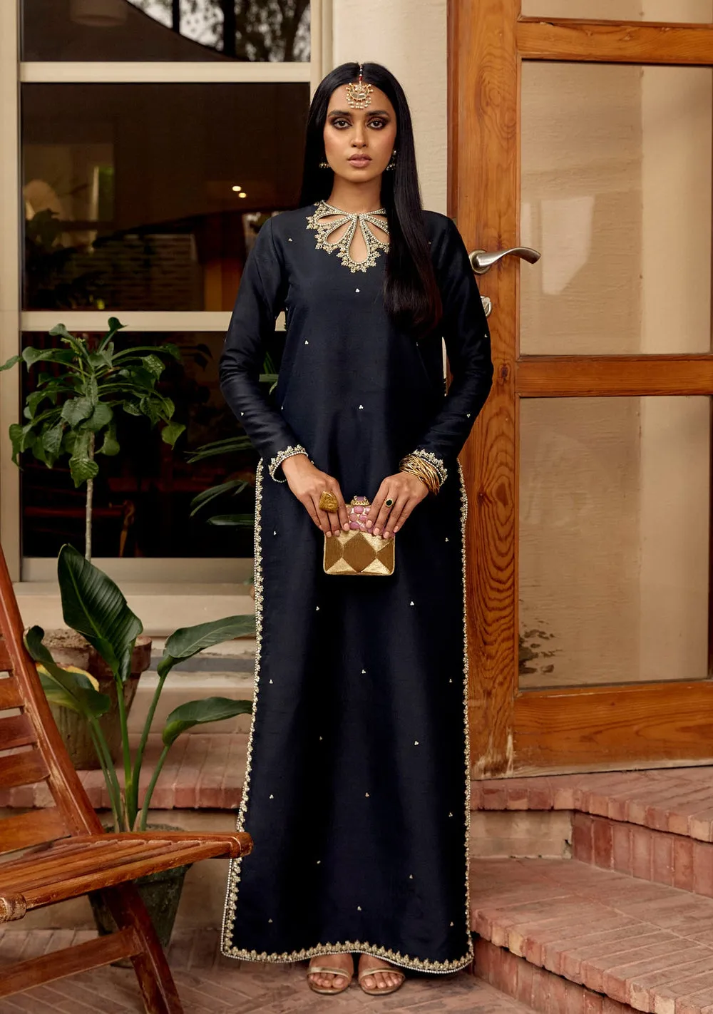 Embellished Raw Silk Cutout Shirt with Cigarette Pants – Front view showcasing intricate handwork with kora, dabka, pearls, and sequins on a black raw silk shirt paired with cigarette pants and an organza dupatta.
