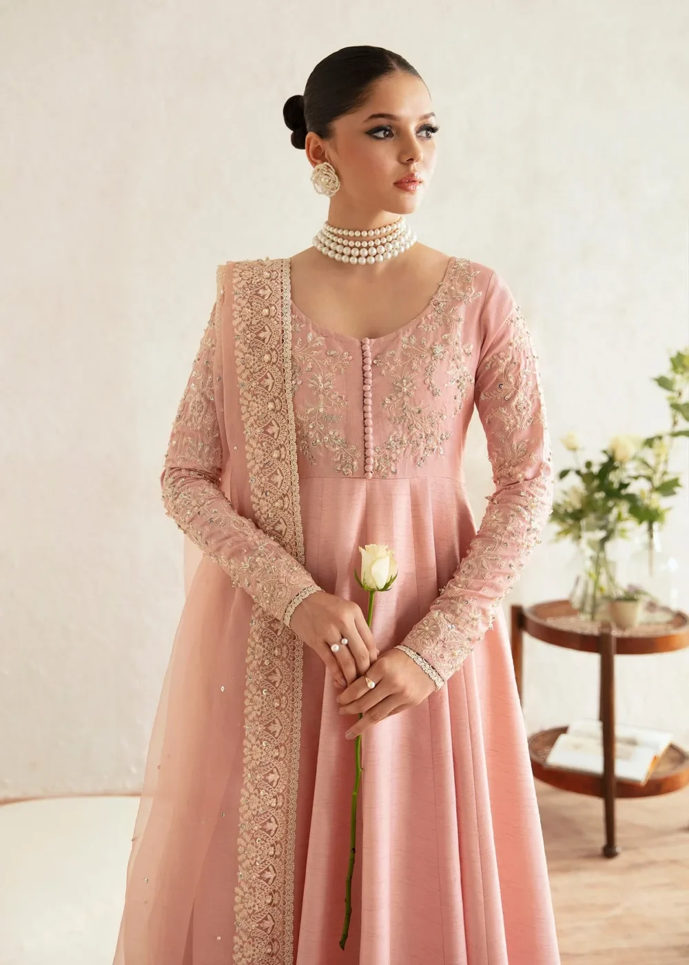 "Blush pink pishwas with intricate embroidery and hand embellishments"
