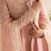 "Blush pink pishwas with intricate embroidery and hand embellishments"