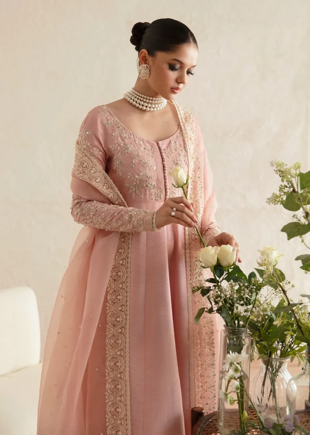 "Blush pink pishwas with intricate embroidery and hand embellishments"