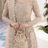 Nude Peshwas ensemble with delicate embroidery and shimmering embellishments