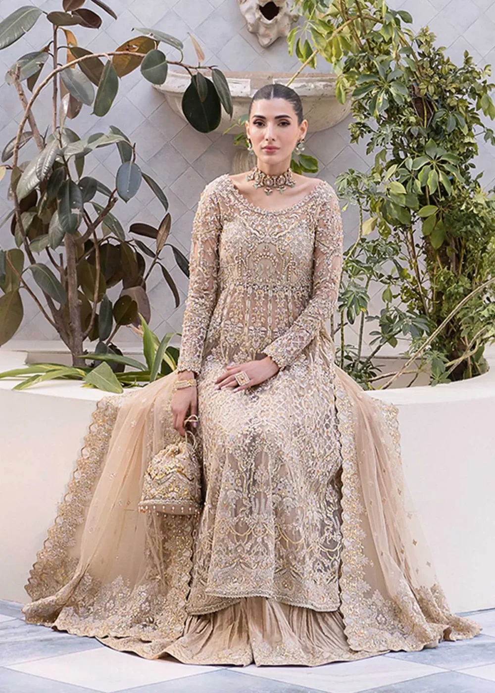 Nude Peshwas ensemble with delicate embroidery and shimmering embellishments