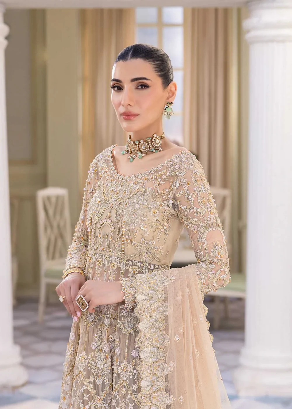 Nude Peshwas ensemble with delicate embroidery and shimmering embellishments