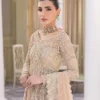 Nude Peshwas ensemble with delicate embroidery and shimmering embellishments