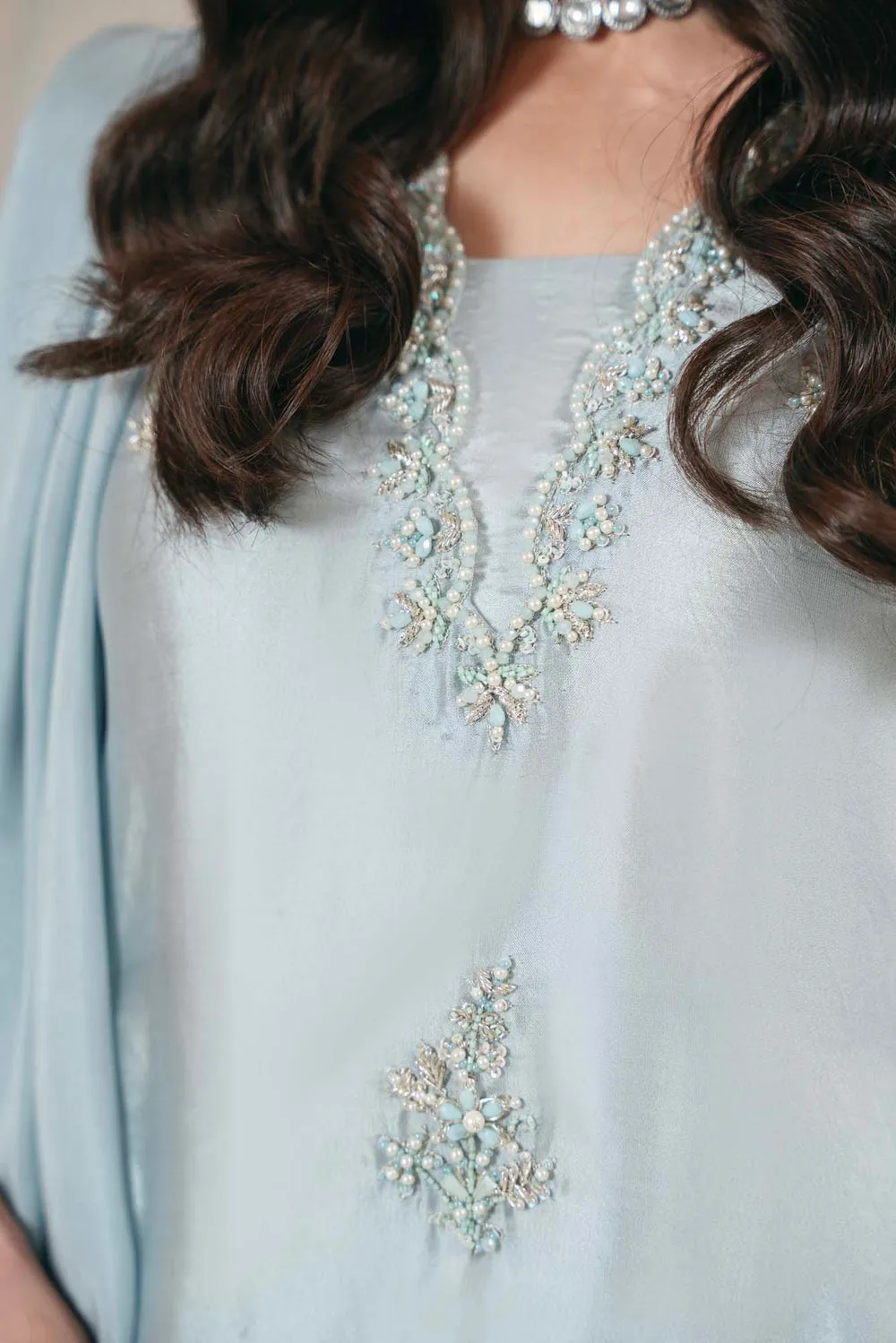 "Sheesha Silk Shirt with Scalloped Neckline Adorned with Pearls and Sequins."