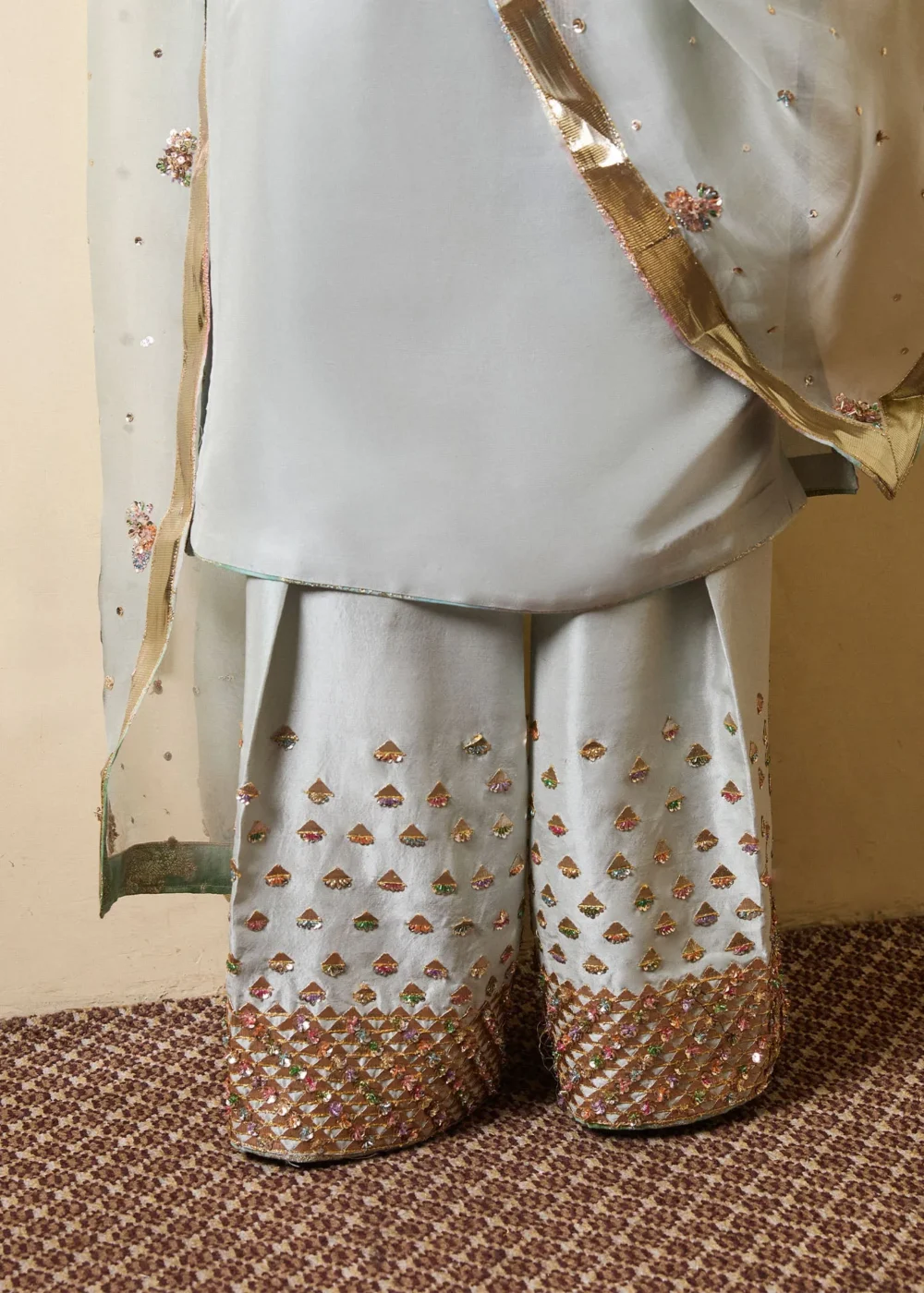"Ice Blue Long Shirt with Choridar Sleeves and Intricate Embellishments"
