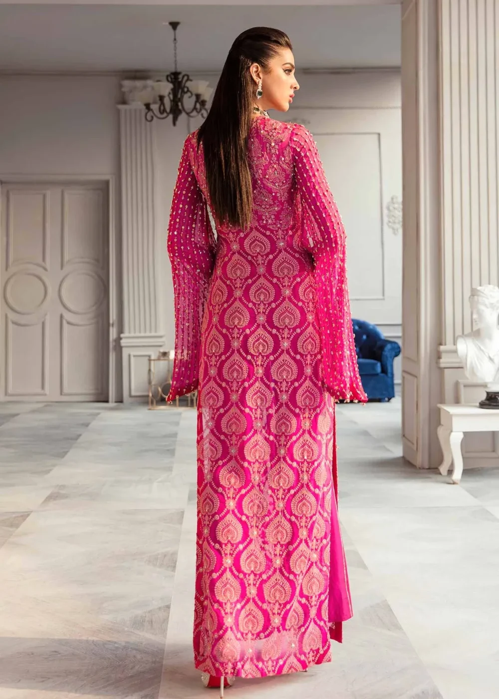 "Shocking pink chiffon shirt with hand embellishments and draped sleeves"