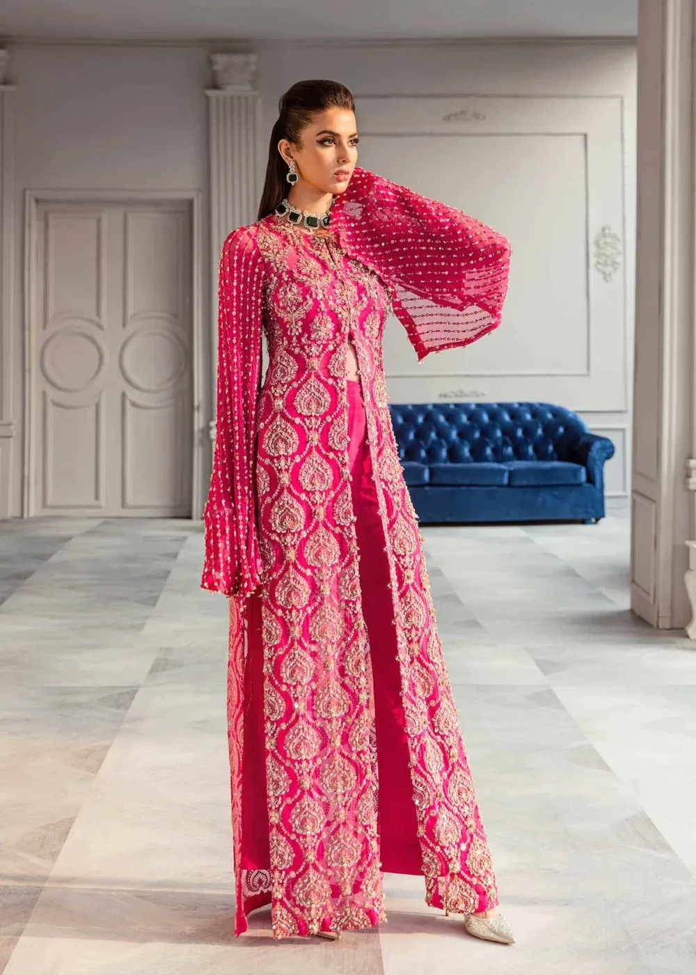 "Shocking pink chiffon shirt with hand embellishments and draped sleeves"