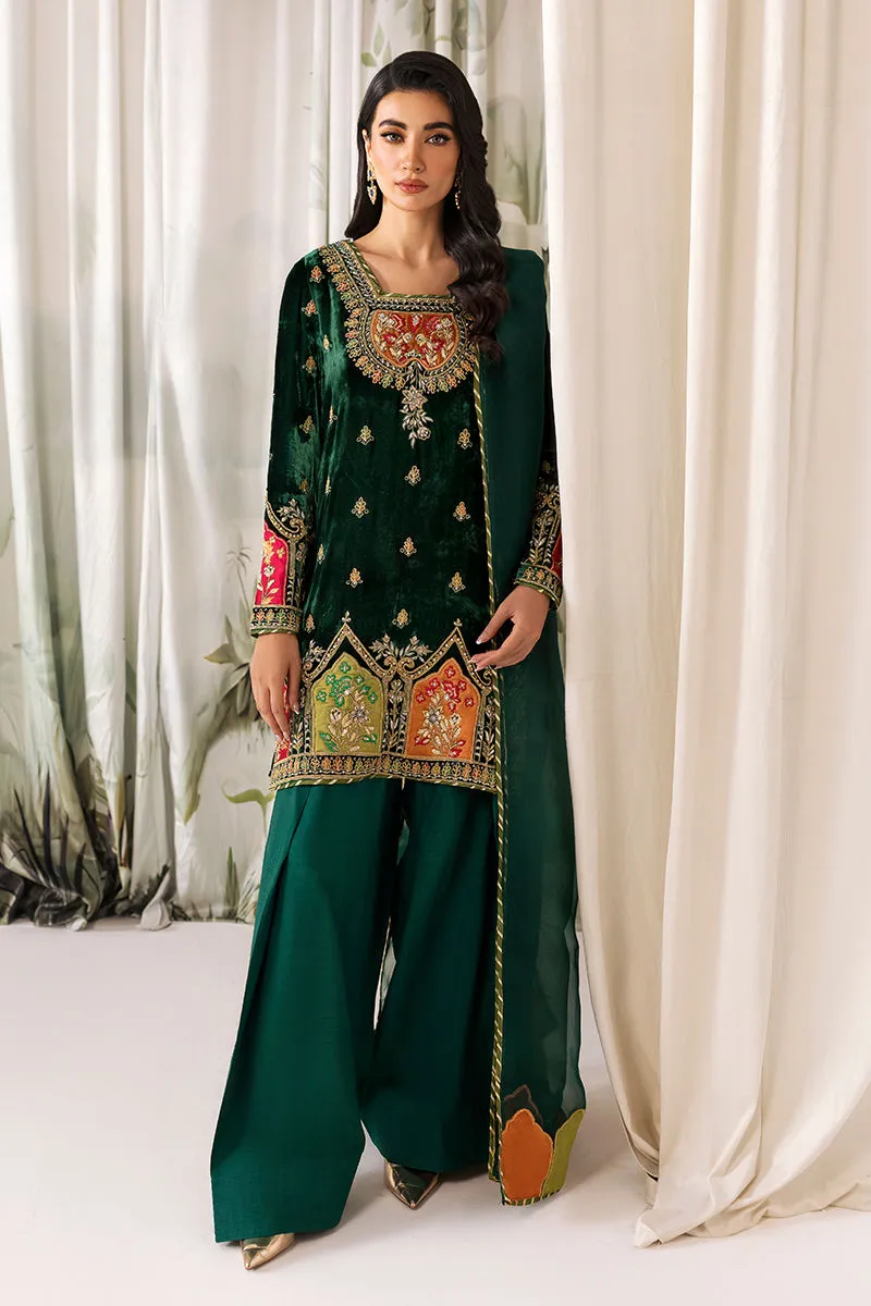 Velvet dress closeup showing intricate applique work