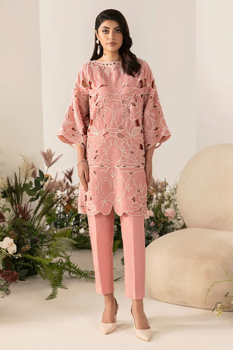 Close-Up of Off White Thread Embroidery on Baby Pink Shirt