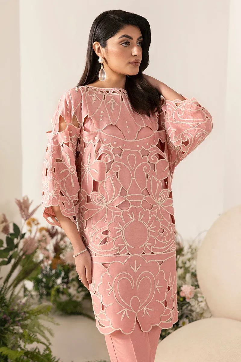 Close-Up of Off White Thread Embroidery on Baby Pink Shirt