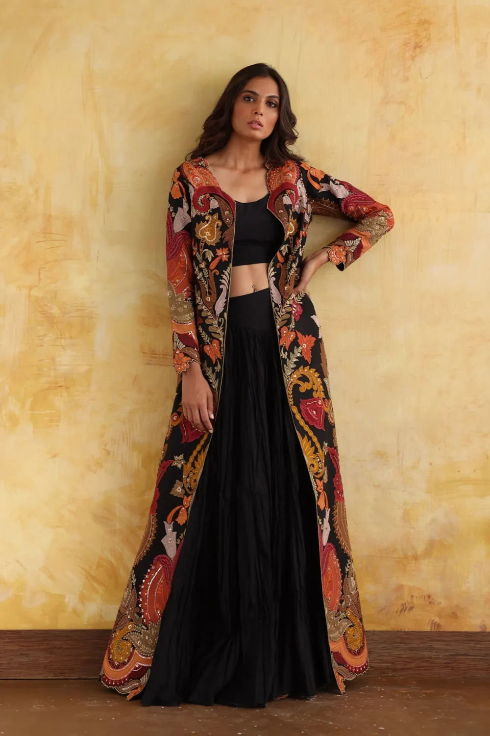 regal embroidered cape gown black orange gold floral motifs luxury design