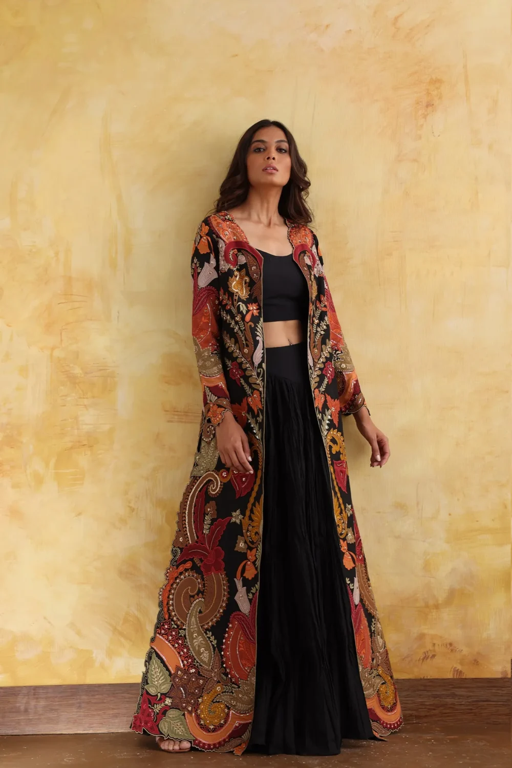 regal embroidered cape gown black orange gold floral motifs luxury design