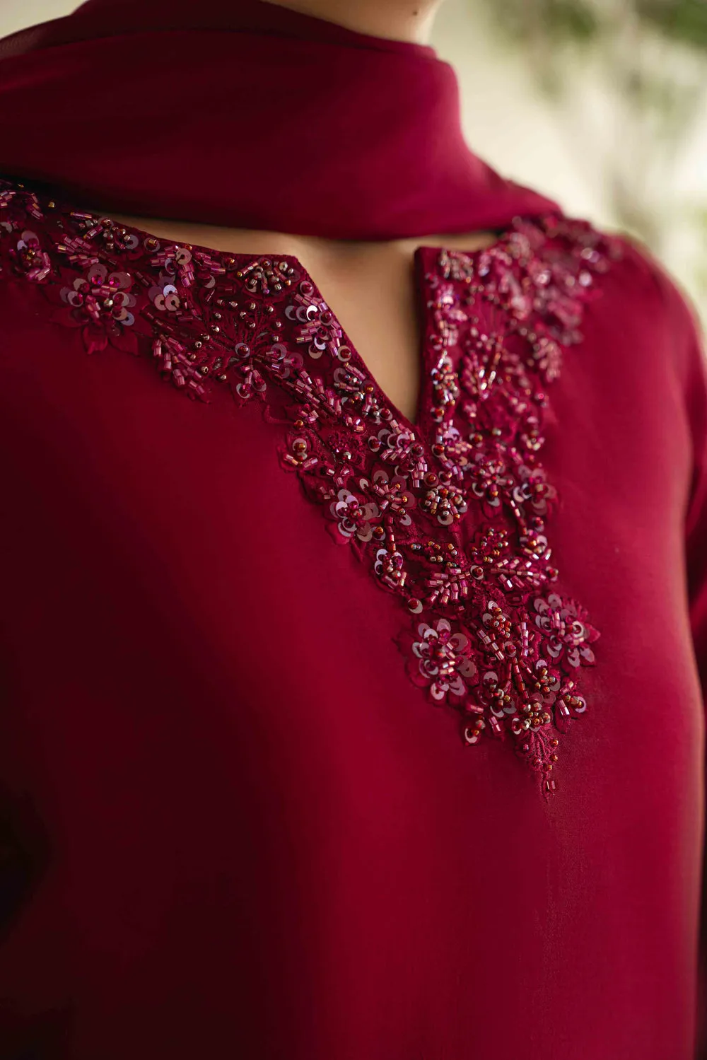 Sheesha Silk Dress with hand-embroidered crystals and sequins on a mannequin, showcasing elegant Korean raw silk trouser