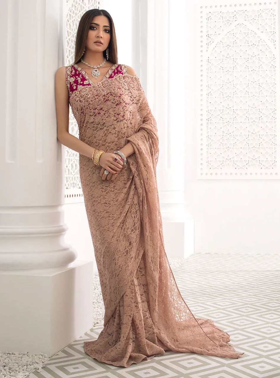 Blush Pink Saree showcasing the full ensemble with the striking magenta blouse and soft pink drape.