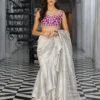 Silver Embellished Saree showcasing the extravagantly draped silhouette and the vibrant magenta blouse.