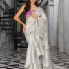 Silver Embellished Saree showcasing the extravagantly draped silhouette and the vibrant magenta blouse.