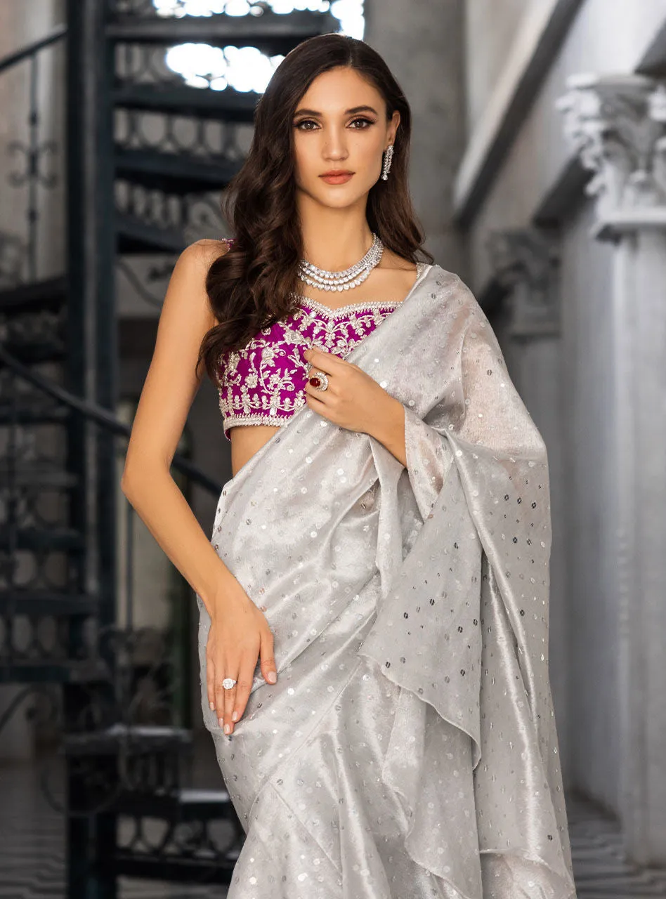 The Silver Embellished Saree in motion, showing the beautiful fluid drape of the shamose silk fabric.