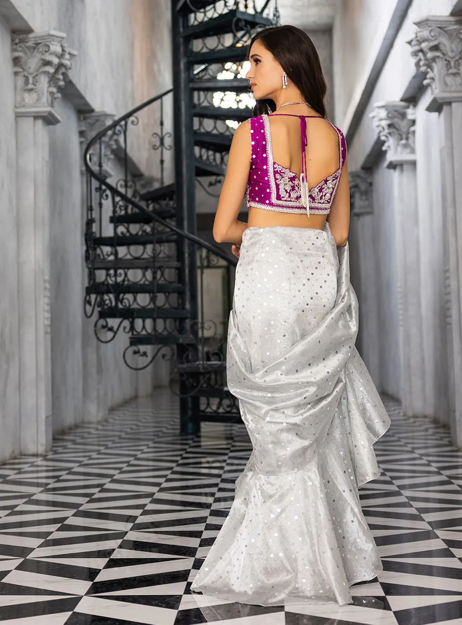 The Silver Embellished Saree in motion, showing the beautiful fluid drape of the shamose silk fabric.