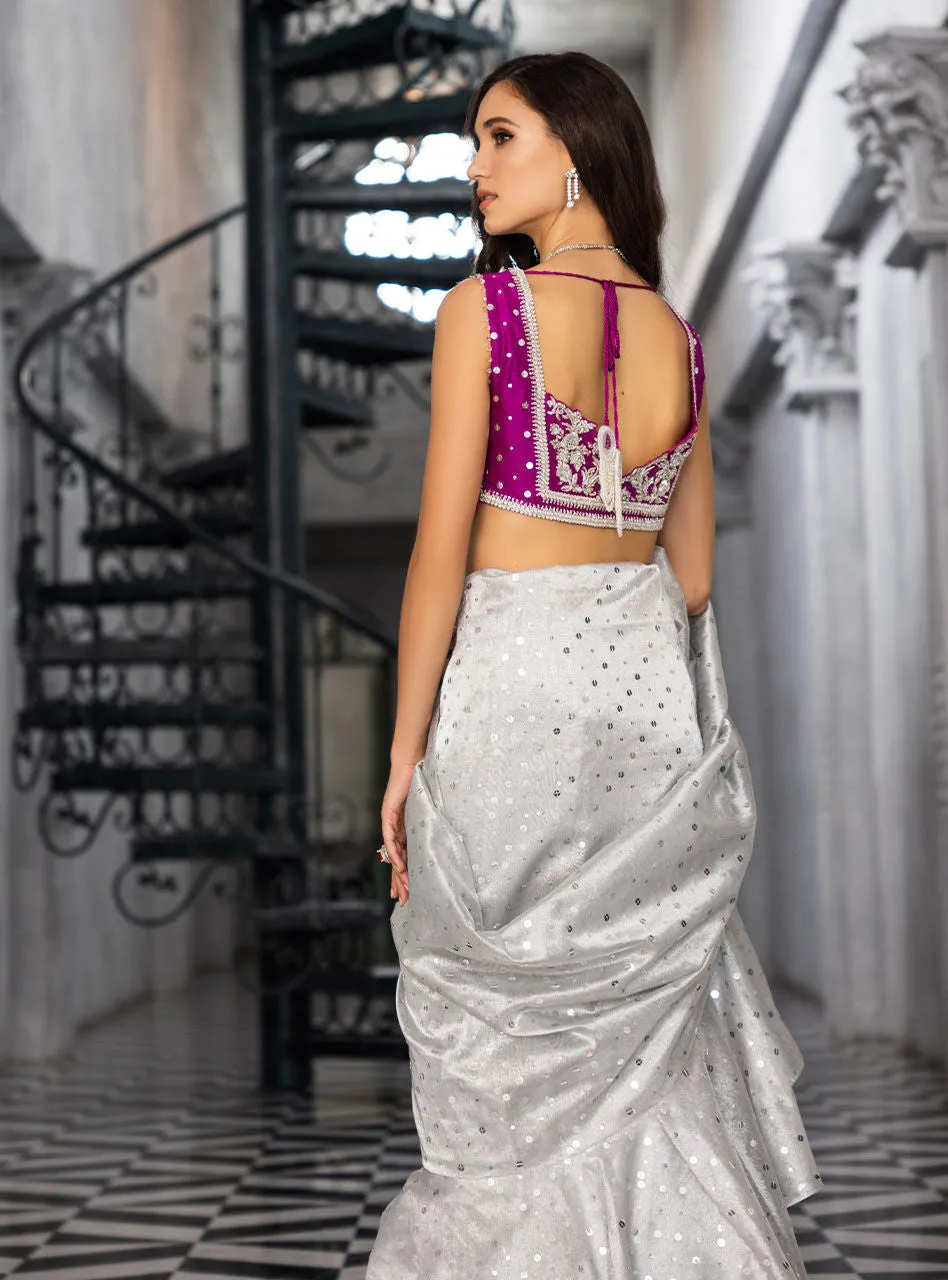 The Silver Embellished Saree in motion, showing the beautiful fluid drape of the shamose silk fabric.